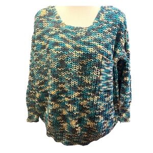 Chaudry KC loose knit chunky sweater with front patch pocket and lace up back.